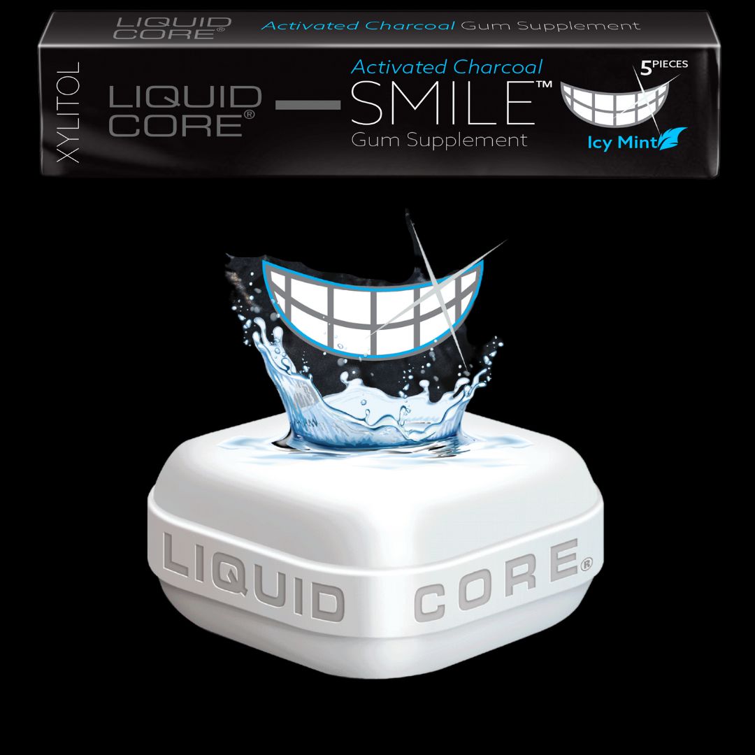 Liquid Core SMILE pack with graphic image of white teeth coming out of the liquid center of a piece of Liquid Core Gum. Hydroxyapatite Gum. Activated Charcoal Gum.